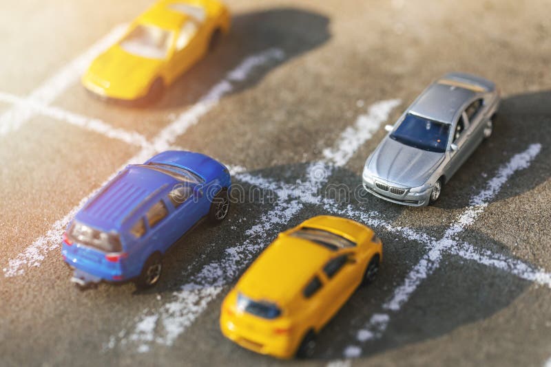 Toy cars on parking lot stock image. Image of place 171683153