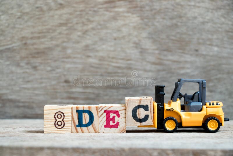Toy forklift hold block c to word 8dec on wood background Concept for calendar date 8 in month December royalty free stock photography Toy forklift hold block c to word 8dec on wood background Concept for calendar date 8 in month December royalty free stock photography