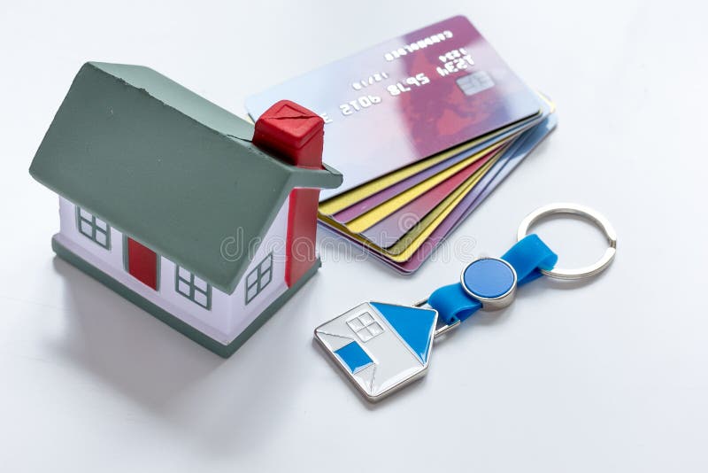 Toy house, credit cards - concept mortgage on white background royalty free stock image Toy house, credit cards - concept mortgage on white background royalty free stock image