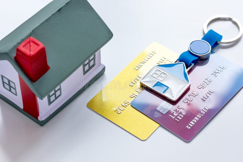Toy house, credit cards - concept mortgage on white background royalty free stock images Toy house, credit cards - concept mortgage on white background royalty free stock images