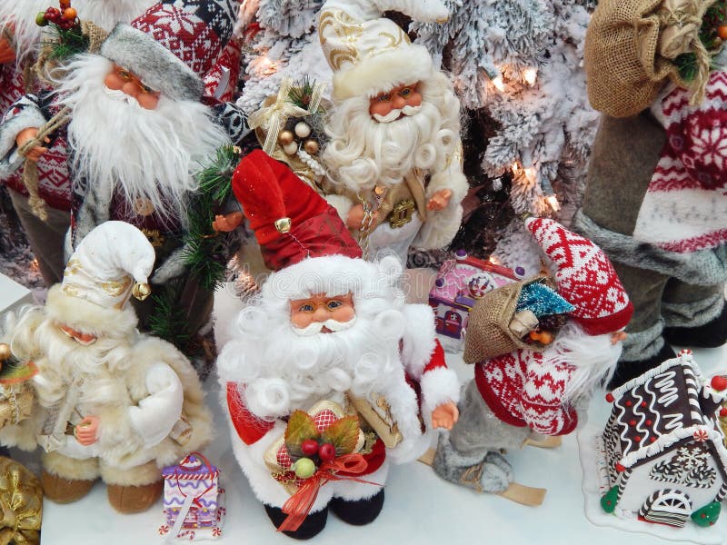 Toy Santa Clauses O Natal brinca o fundo foto de stock royalty free Toy Santa Clauses O Natal brinca o fundo foto de stock royalty free