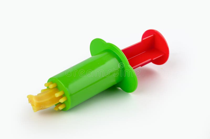 Toy syringe press for playdough stock photo