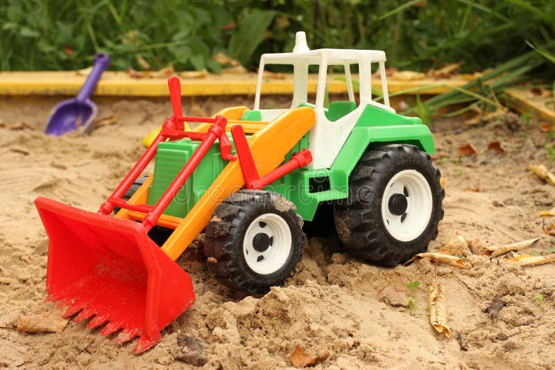 Sandbox. Toy Excavator Stands in a Sandbox Stock Photo Image of