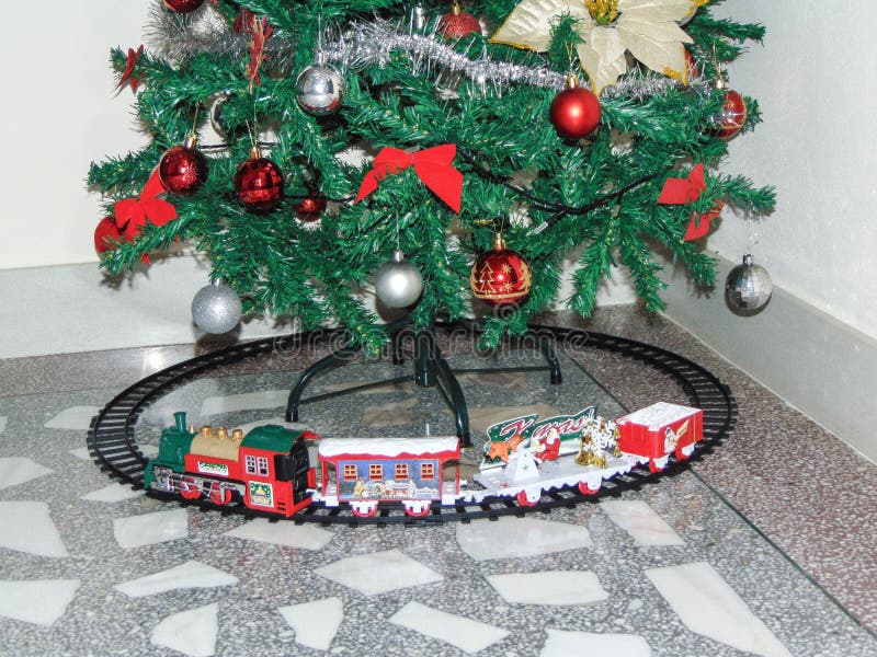 Toy Train Placed Under a Christmas Tree Stock Photo Image of playing