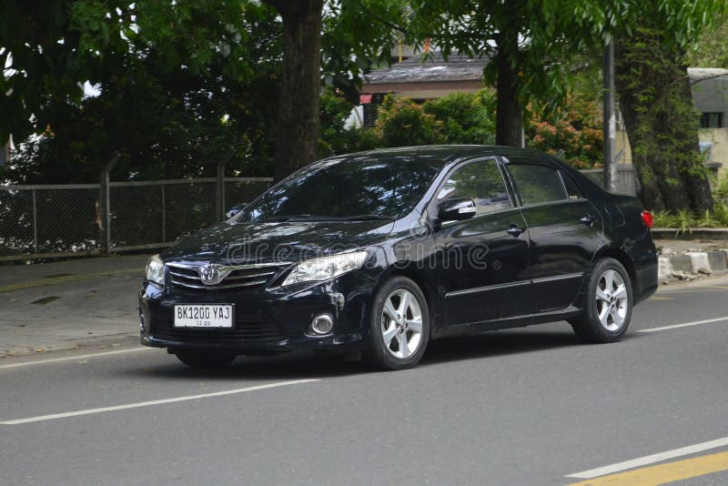 A black sedan Toyota Corolla Altis 1.8V 2014 on the streets in Medan, North Sumatra, Indonesia &#x28;Apr 3, 2024&#x29;. A black sedan Toyota Corolla Altis 1.8V 2014 on the streets in Medan, North Sumatra, Indonesia &#x28;Apr 3, 2024&#x29;.