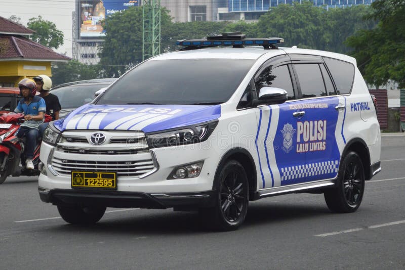 A white Toyota Innova Venturer 2019 &#x28;Indonesian Police Car&#x29; on the streets in Medan, North Sumatra, Indonesia &#x28;Apr 30, 2024&#x29;. A white Toyota Innova Venturer 2019 &#x28;Indonesian Police Car&#x29; on the streets in Medan, North Sumatra, Indonesia &#x28;Apr 30, 2024&#x29;.