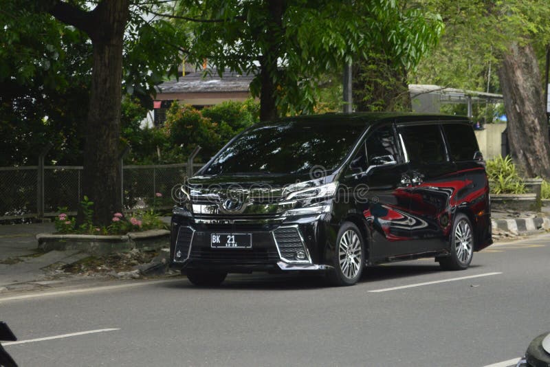 A black van Toyota Vellfire AH30 2.5 on the streets in Medan, North Sumatra, Indonesia &#x28;Apr 3, 2024&#x29;. A black van Toyota Vellfire AH30 2.5 on the streets in Medan, North Sumatra, Indonesia &#x28;Apr 3, 2024&#x29;.