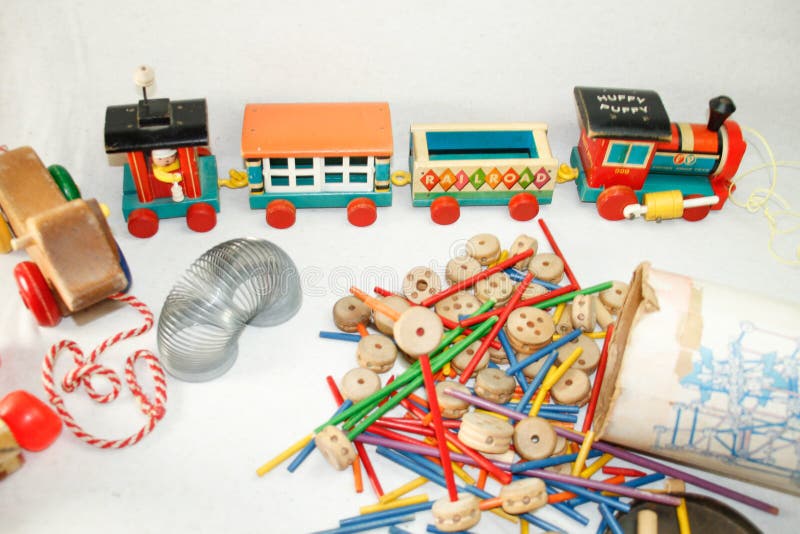 TOYS NOT GUNS!  wooden tinker toys.. antique huffy puppy wooden train 4 cars with caboose, slinky, animal pull toys on wheels