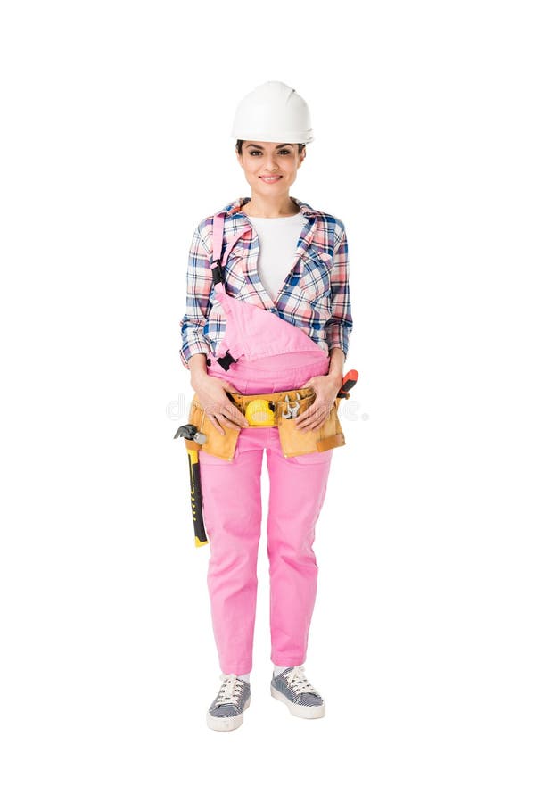 Trabajador de construcción de sexo femenino alegre en uniforme rosado imagen de archivo libre de regalías Trabajador de construcción de sexo femenino alegre en uniforme rosado imagen de archivo libre de regalías
