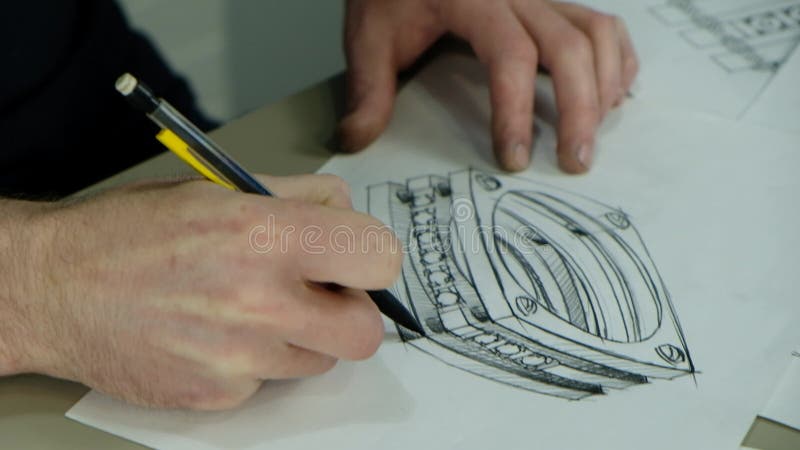 Trabajo de herrero artesanal. retrato de una joven joyera dibujando un bosquejo de un nuevo anillo. concepto de : joyas de lujo pa