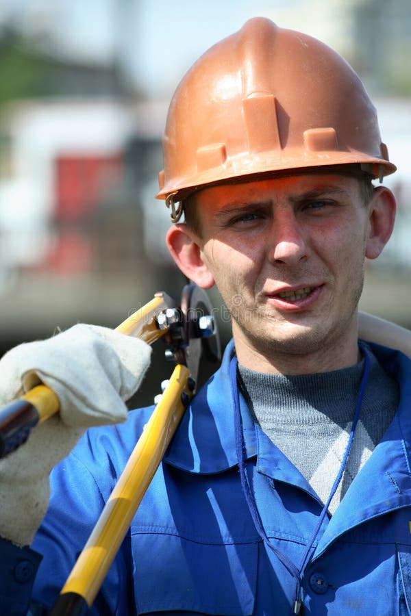 Working in helmets and with scissors. Working in helmets and with scissors