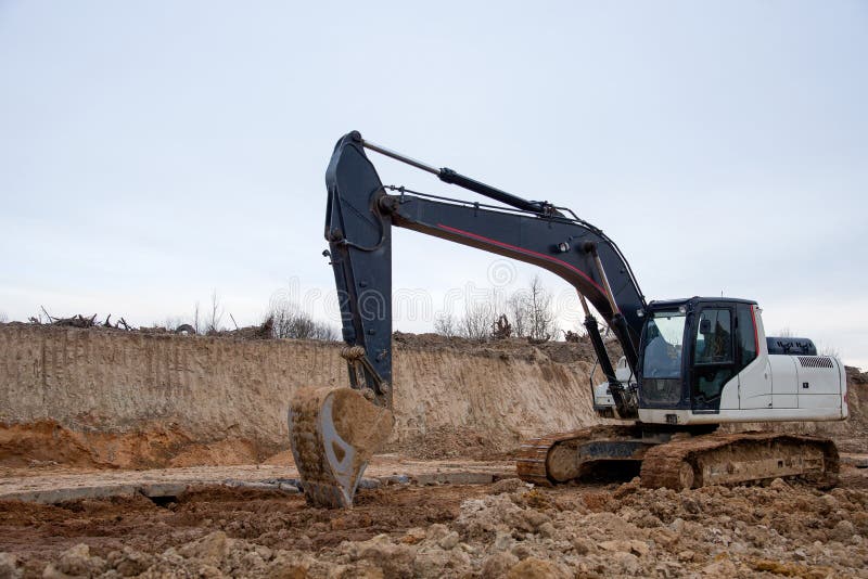Tracktype Excavator during Earthmoving Works at Openpit Mining