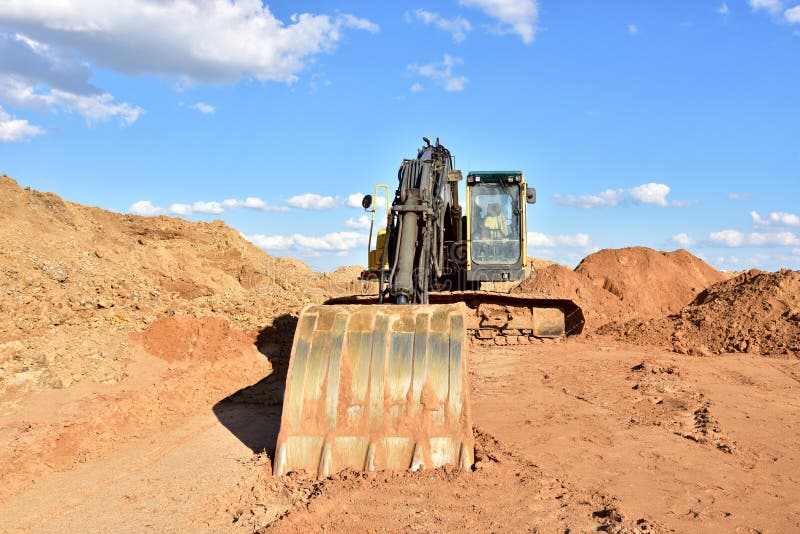 Tracktype Excavator during Earthmoving Works at Openpit Mining