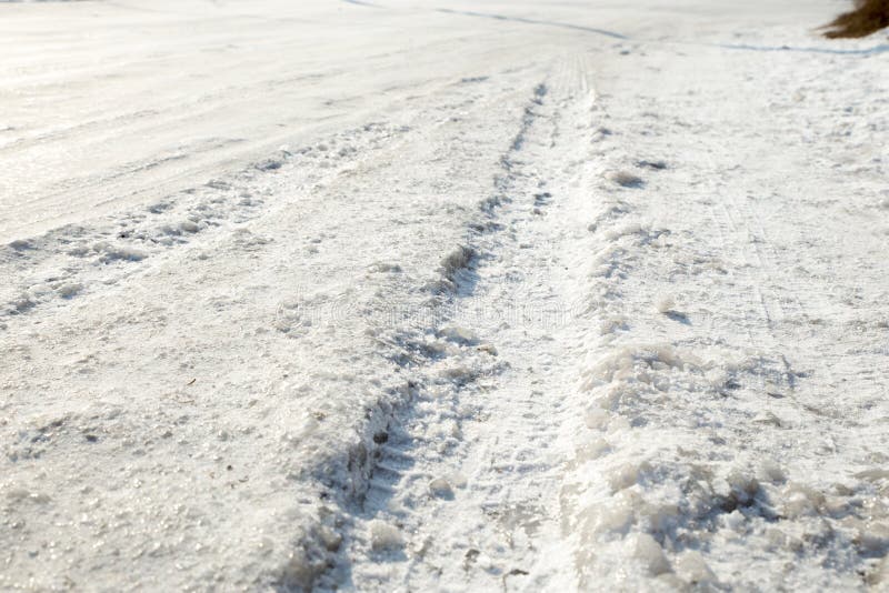 The Wheel of the Car on Slippery Winter Road. Studded Rubber on Ice ...