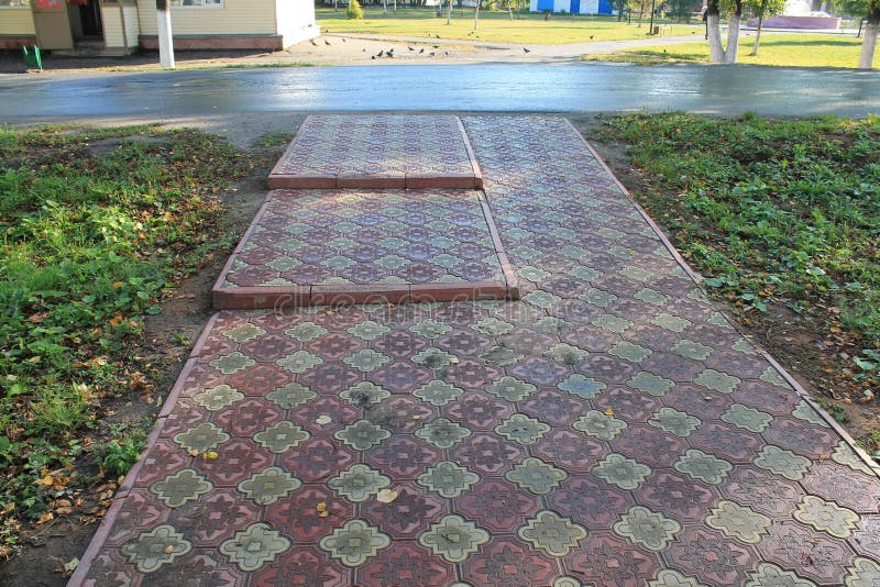 Tracks from tiles stock image. Image of pavers, tile 76410433