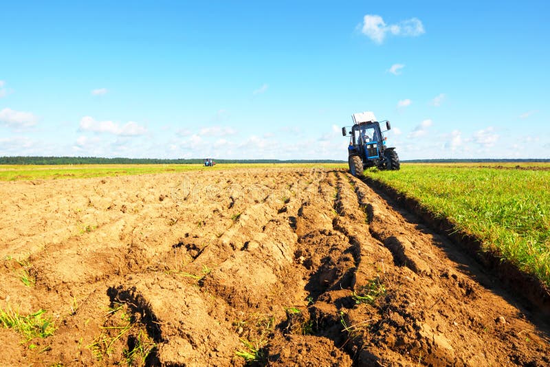 Tractor on a farmer field royalty free stock photography