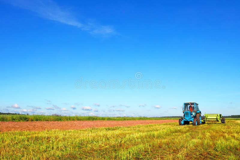 Tractor on a farmer field stock photos