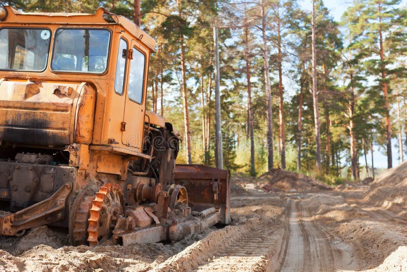 Tractor in the forest stock photo. Image of machine 104180812