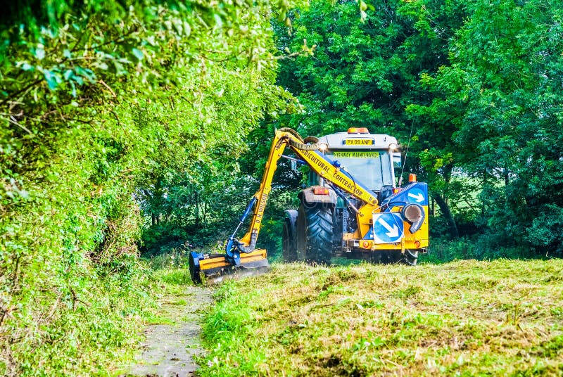 Tractor Mowing Grass Along A Road In UK Editorial Stock Image Image