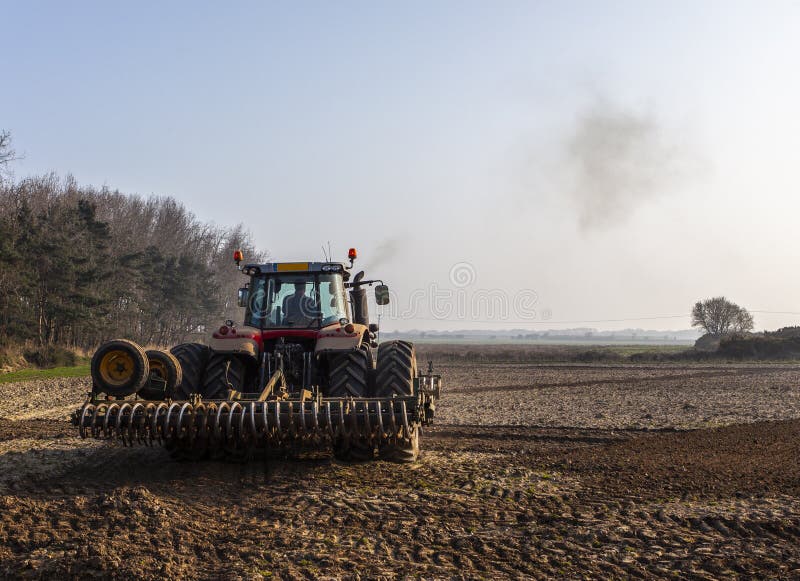 Tractor Plowing the Land in the Morning Editorial Photo Image of