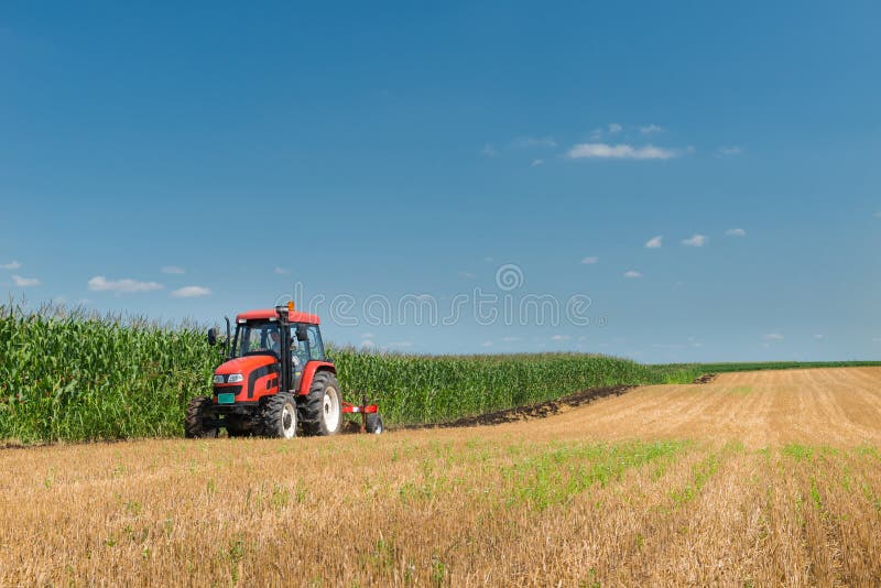 Tractor plowing royalty free stock images