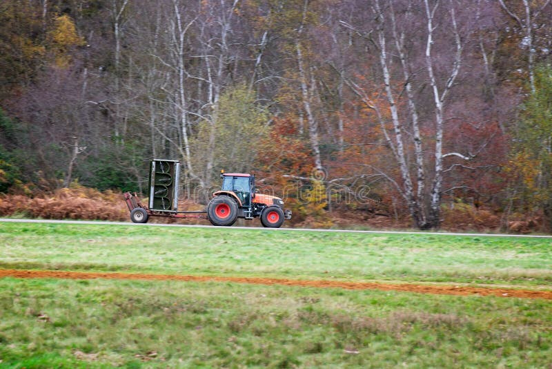 Tractor on the road editorial photography. Image of equipment 235118452