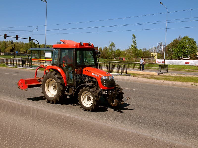Tractor on the road. editorial photo. Image of city, reportage 71050396