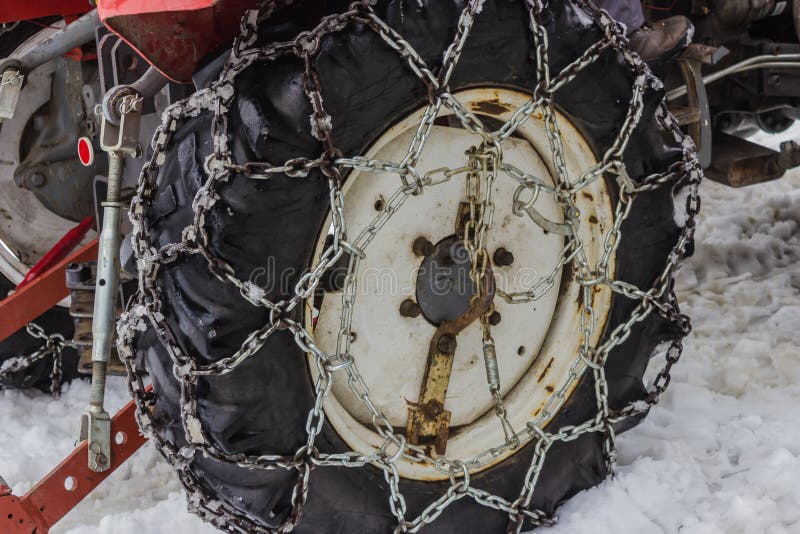 A Tractor Tire with Snow Chain Stock Photo Image of rusty, clearing 140032020