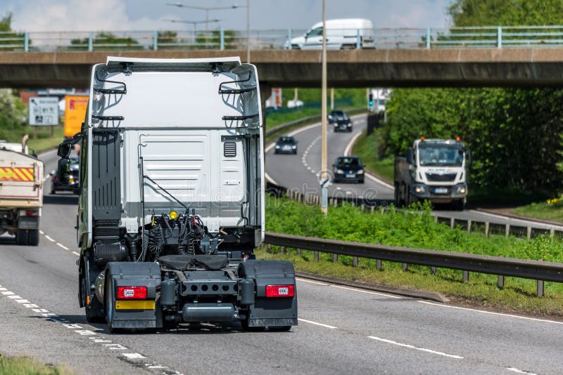 Tractor unit lorry truck on uk motorway in fast motion royalty free stock photo Tractor unit lorry truck on uk motorway in fast motion royalty free stock photo