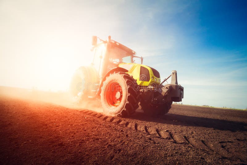 Tractor Working on Farm Land on Sunset Stock Photo Image of meadow