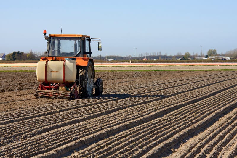 Tractor working on the field stock photography