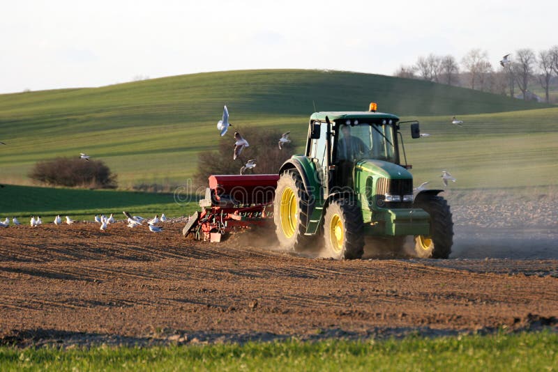Tractor working on the field stock photography