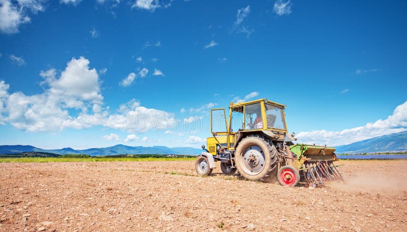 Tractor working in the field. royalty free stock photography
