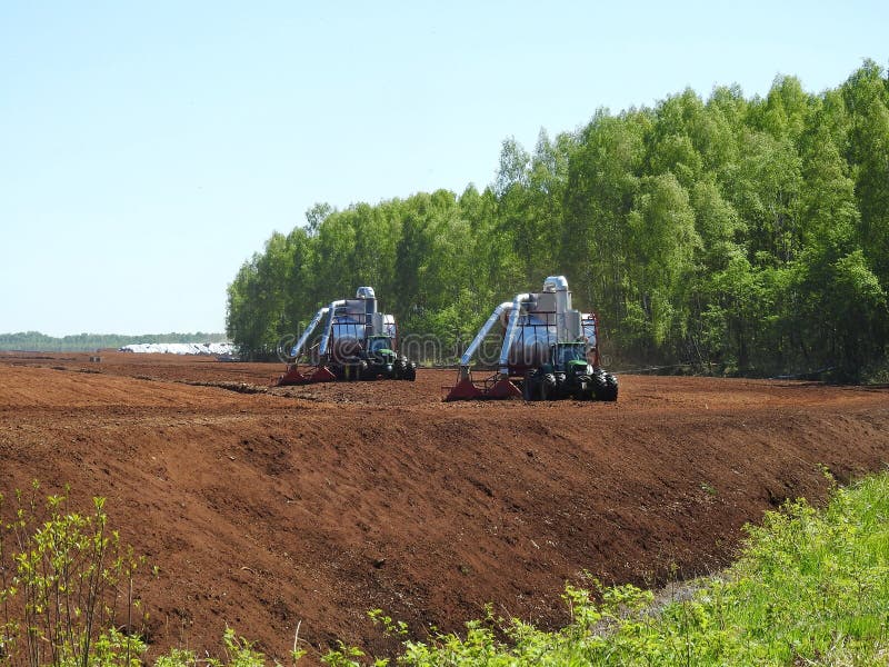 Tractors working in marsh royalty free stock image Tractors working in marsh royalty free stock image