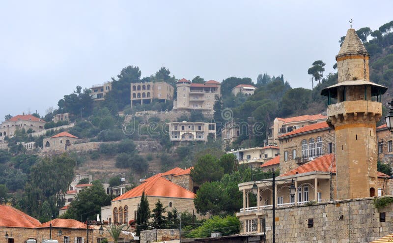 A traditional Lebanese village containing arched windows and entrances while topped with brick along with a mosque in the foreground, a mixture of French and Turkish identities embedded, since their time-line of occupation respectively. A traditional Lebanese village containing arched windows and entrances while topped with brick along with a mosque in the foreground, a mixture of French and Turkish identities embedded, since their time-line of occupation respectively