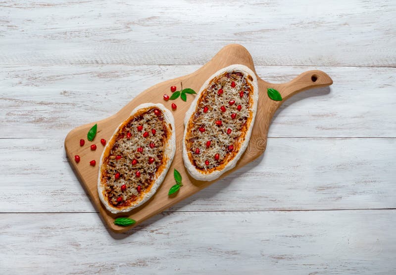 Traditional Arabic Pizza Manaqish with Meat and Pomegranate. Stock