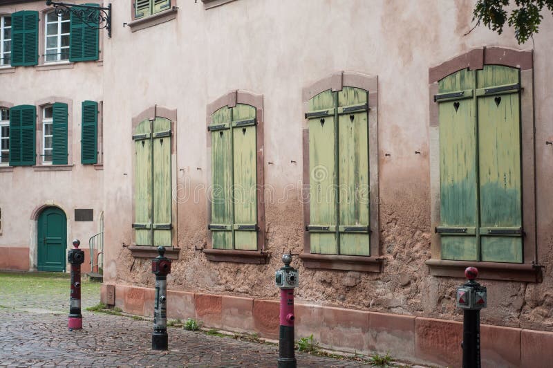 Traditional architecture in Mulhouse - France - Closeup of wooden shutters on stoned facade