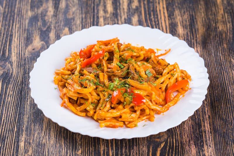 Traditional Asian Noodle Lagman with Vegetables and Meat Stock Image ...