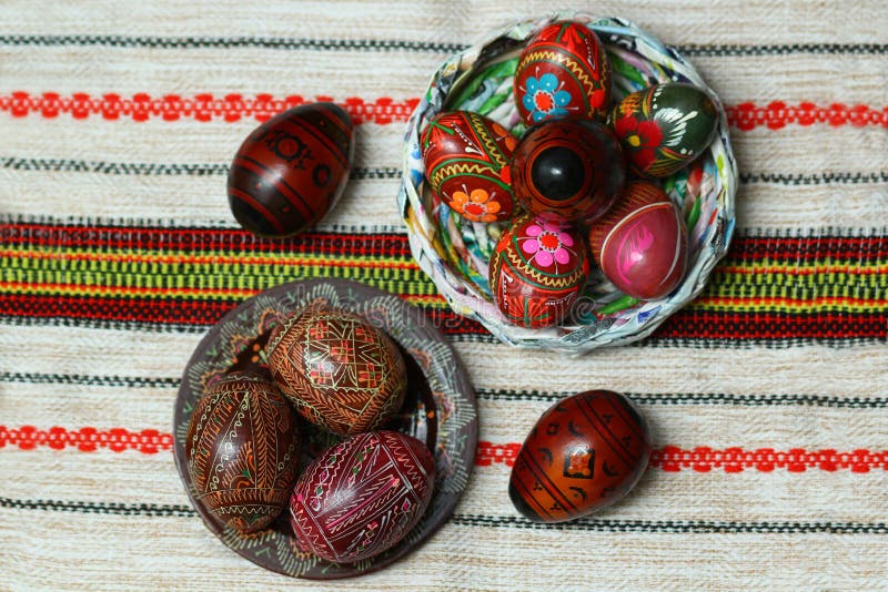 Traditional authentic ukrainian painted Easter eggs on traditional embroidered napkin or table cloth rushnyk. Flat lay top view