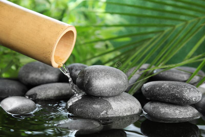 Traditional bamboo fountain with zen stones royalty free stock image Traditional bamboo fountain with zen stones royalty free stock image