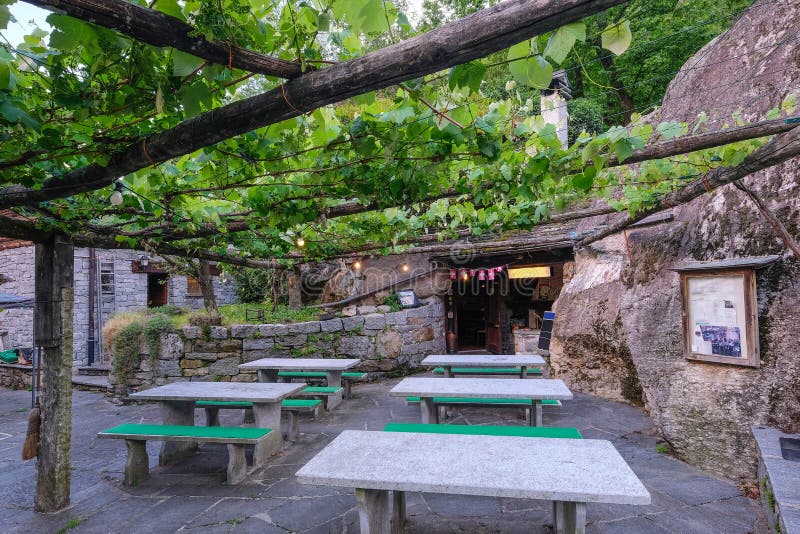 Traditional beautiful rock grotto, a little restaurant built into the rock face in Ticino, Southern Switzerland