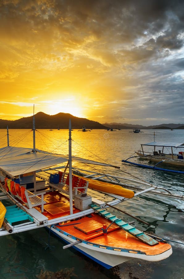Traditional boats at sunset. Philippines royalty free stock images