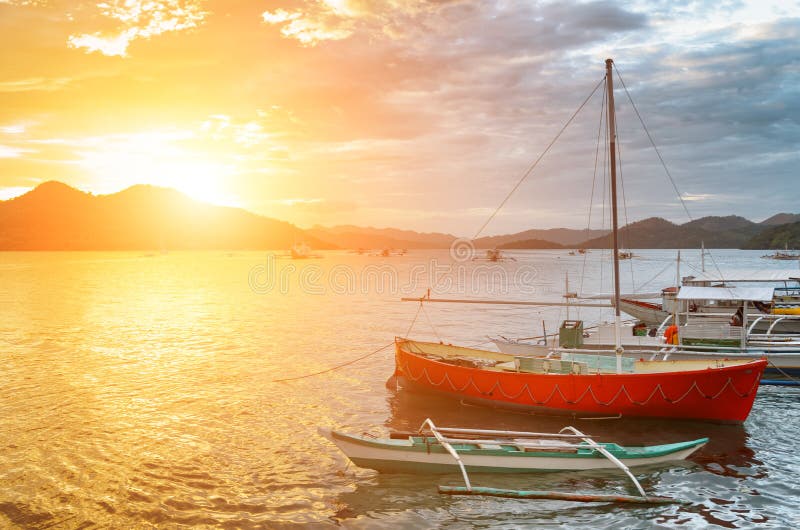 Traditional boats at sunset. Philippines stock photography