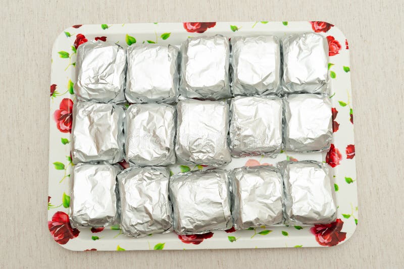 Cakes in foil pans stock photo. Image of homemade, brown - 180386150