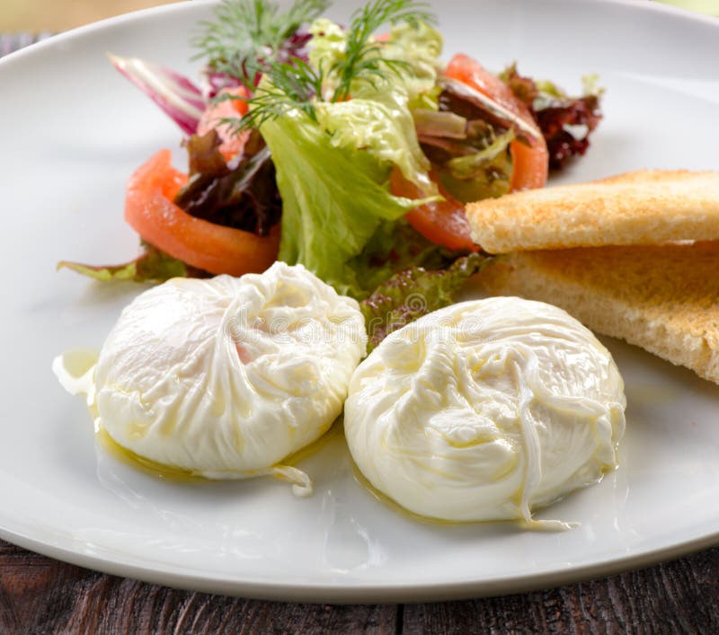 Traditional Breakfast of Poached Eggs Stock Photo - Image of table ...