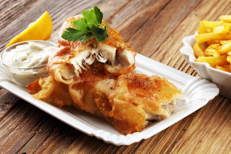 Traditional British Fish and Chips Consisting of Fried Fish, Pot Stock