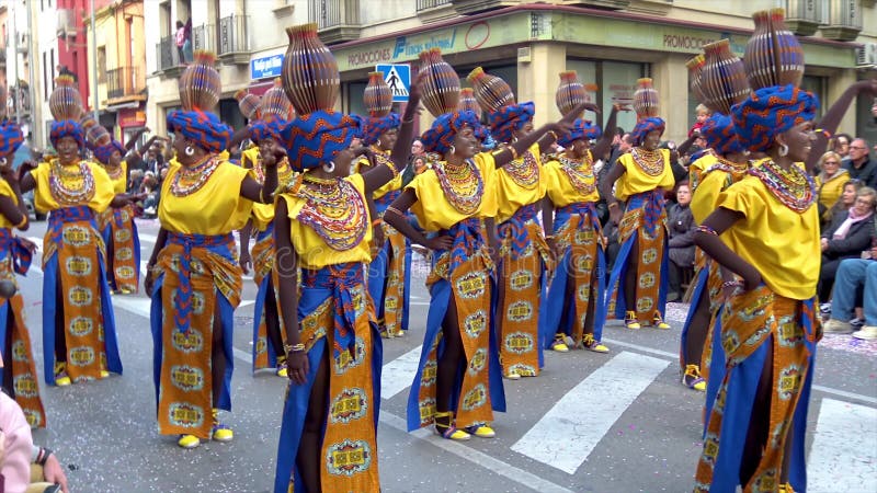 Traditional carnival in a Spanish town Palamos in Catalonia. Many people in costume and interesting make-up dancing on the street.
