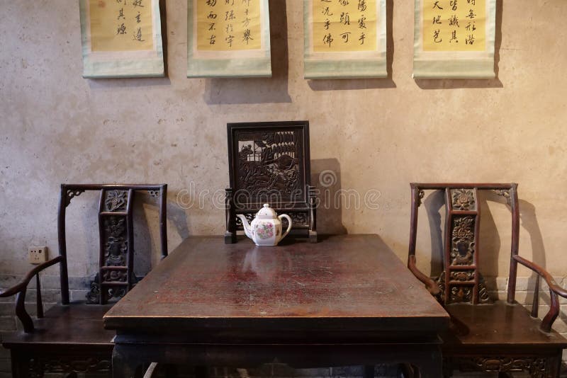 Traditional Chinese Residences interior wooden table chair scroll painting and pot in Tianshui Folk Arts Museum Hu Shi folk house