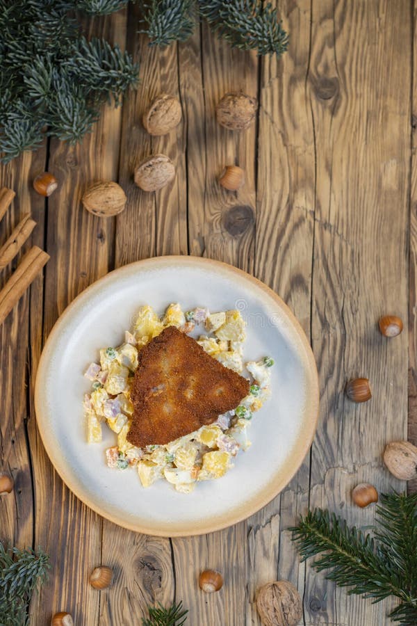 Traditional Christmas dinner in Czech Republic - carp fillet with potato salad