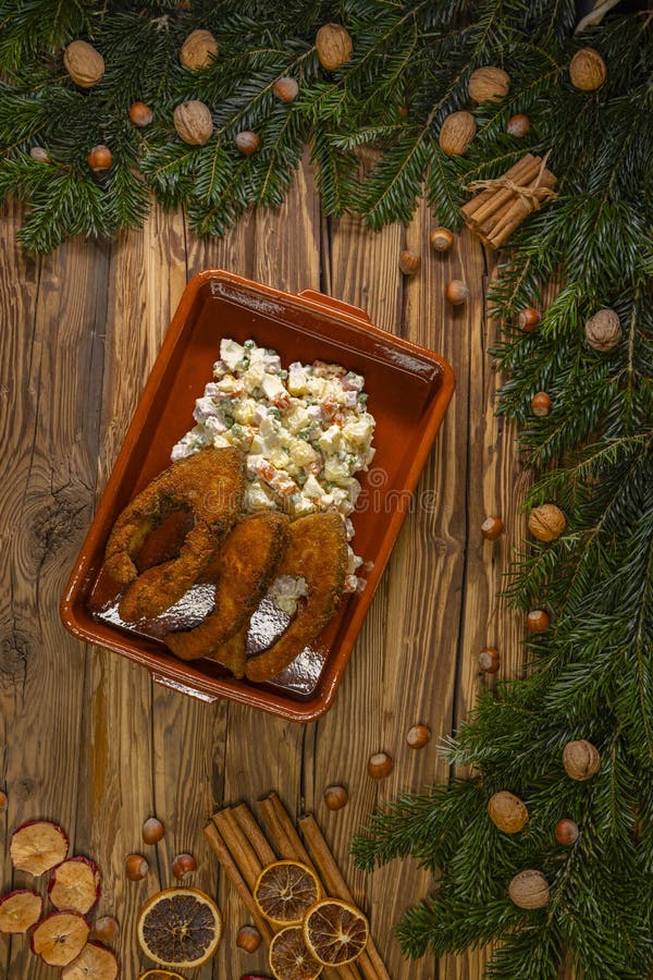 Traditional Christmas dinner in Czech Republic - fried carp with potato salad